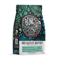 The front of a 12 ounce bag of Bones Coffee Company Breakfast Blend coffee. It is a medium roast, and it has leaves and plant life around the Bones Coffee Company logo on the art.