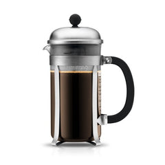 French press filled with brewed coffee.