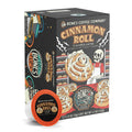 A box of Bones Coffee Cinnamon Roll Bones Cups flavored coffee. On the art of the box is a skeleton holding out a fresh cinnamon roll.