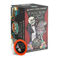 The front of the Bones Coffee Company Coco Crush 12 Count Bones Cups box. Its flavor is coconut macaron, and it has a skeleton dressed in a suit holding a tray of macaron with a rose between its teeth on the art.