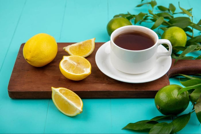 cup of lemon tea with fresh citrus