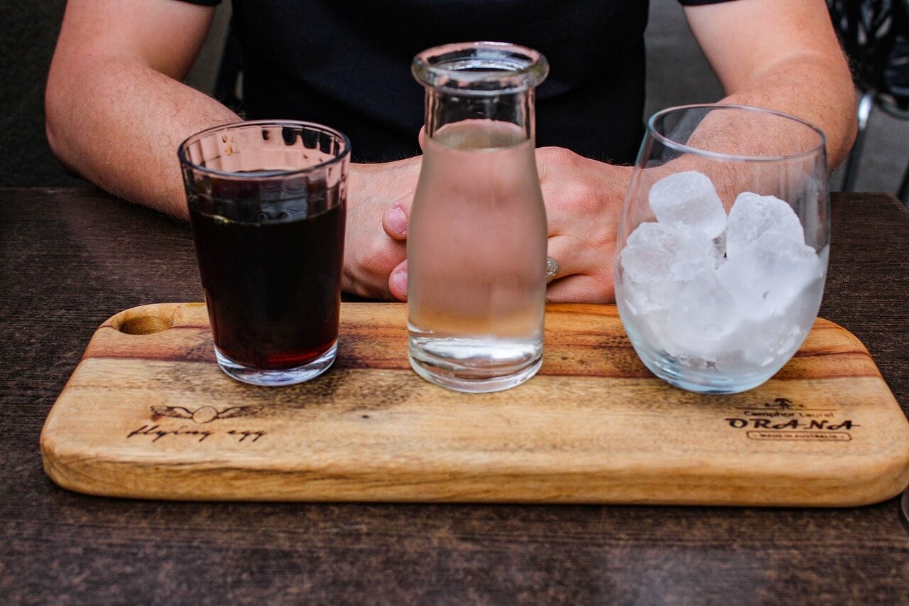 Glasses with iced coffee & coffee ice cubes