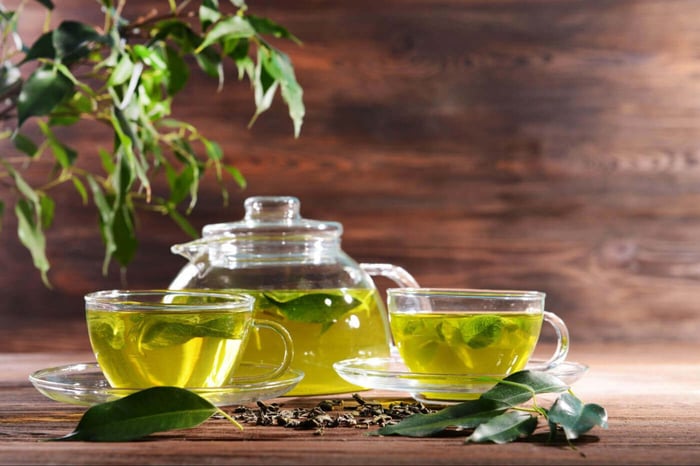 glass teacups with fresh green tea
