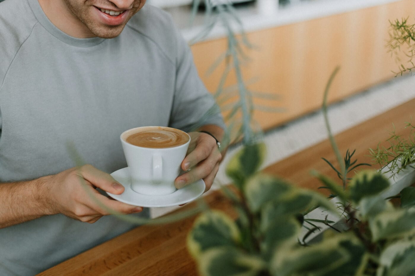 man holding a cup of coffee