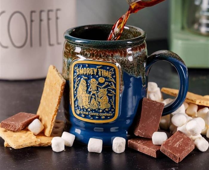 pouring coffee into Bones Coffee Company mug